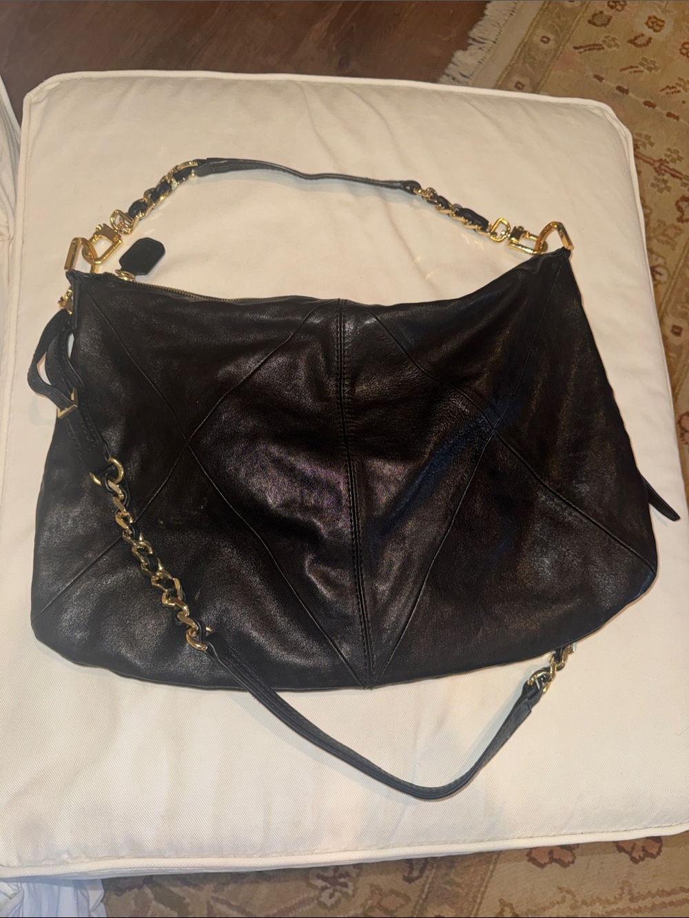 Black Leather Shoulder Bag with Gold Chain Accents